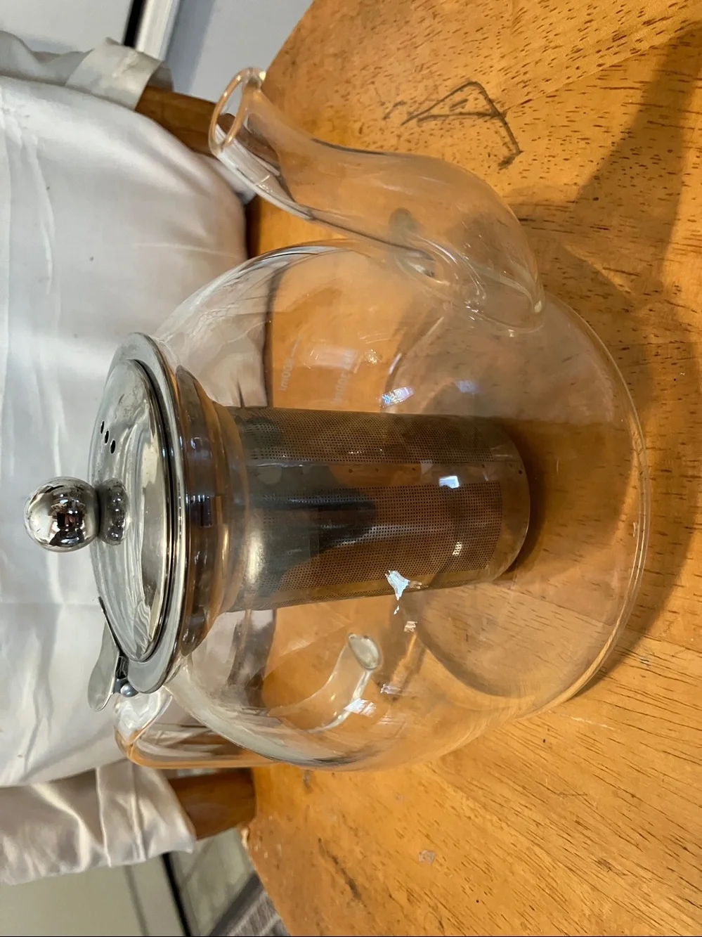 Like new. French press style glass tea pot with stainless steel pieces